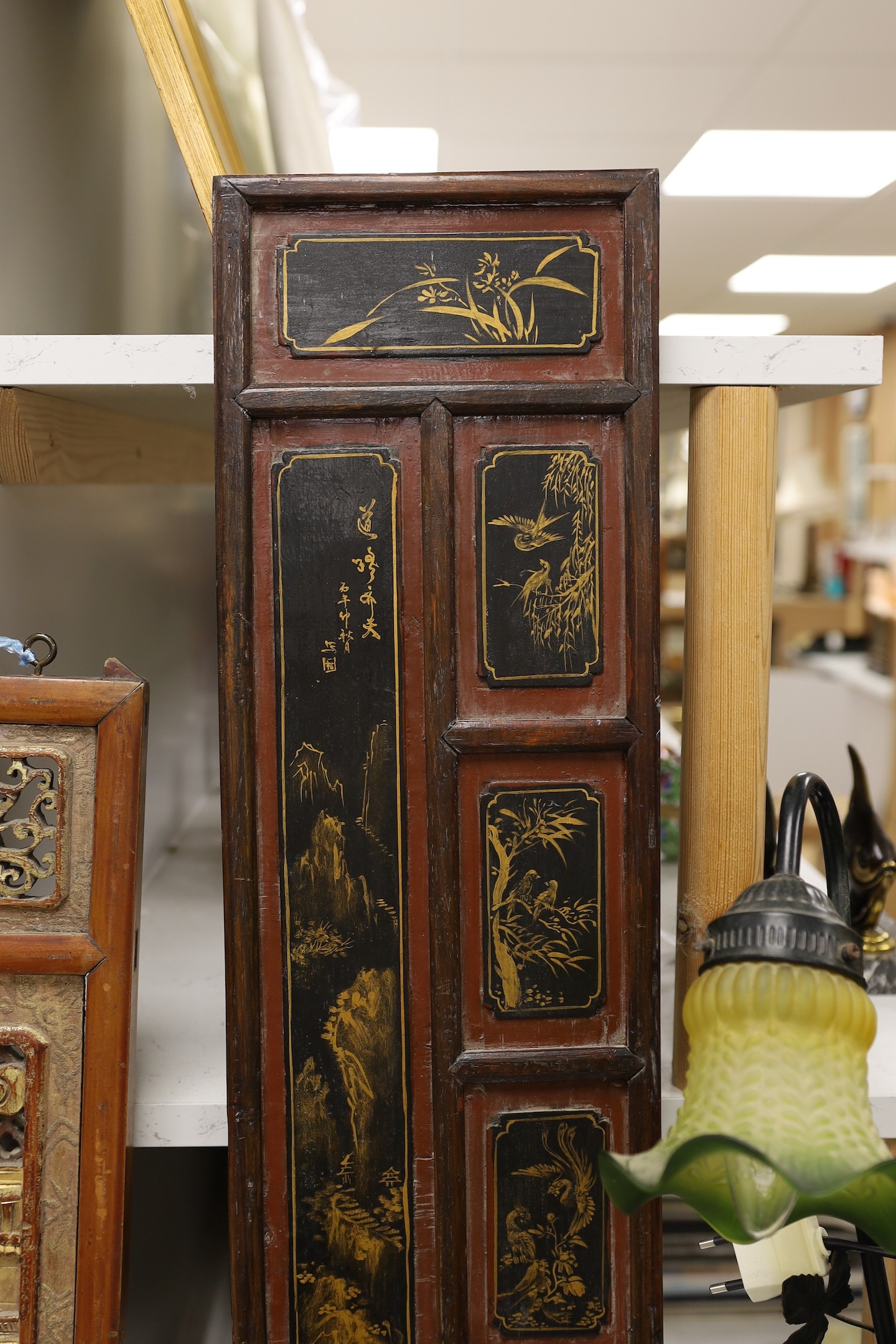 A pair of late 19th century Chinese gilt-decorated lacquer panels and a similar smaller rectangular pierced panel, tallest 91cms high